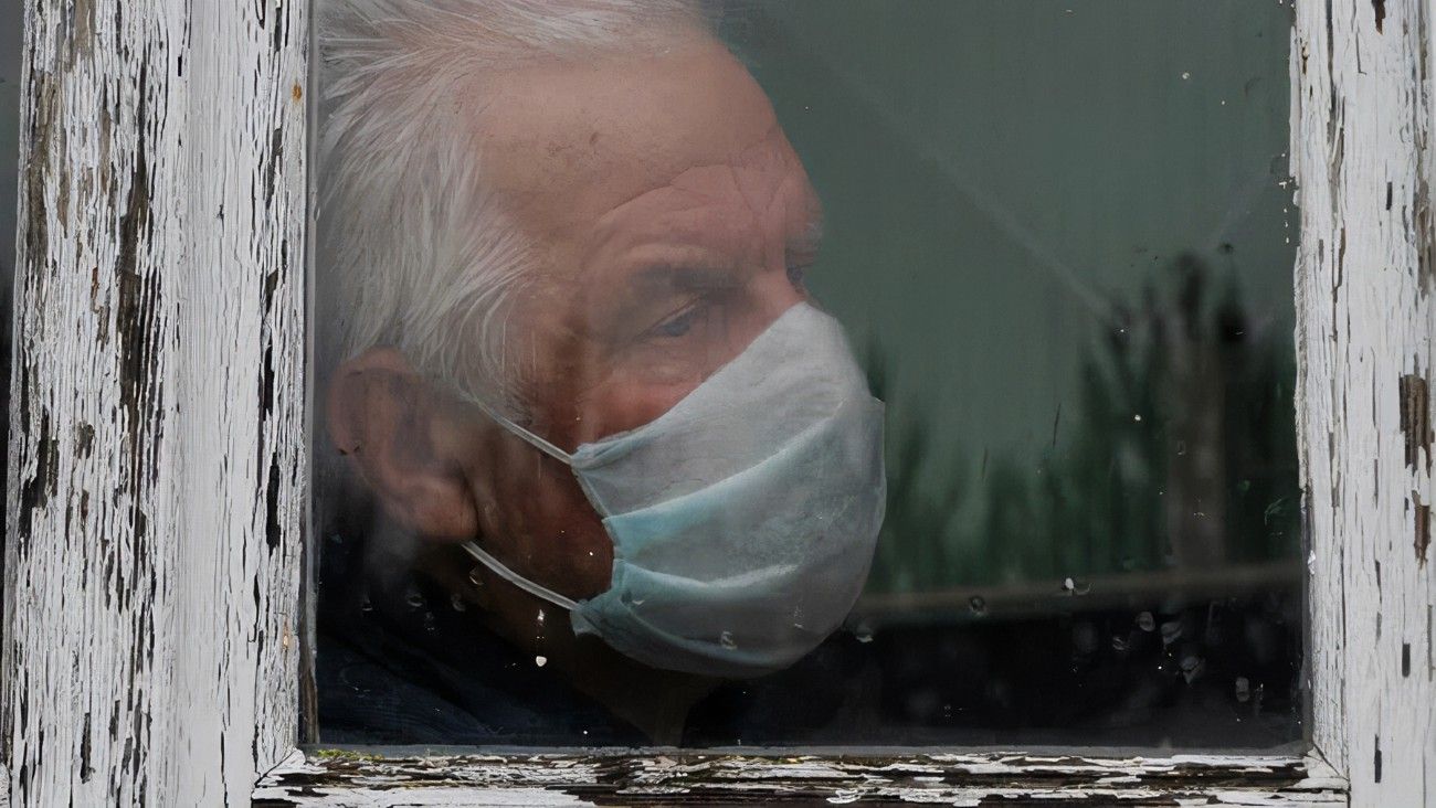 At Pandemic Covid Old Man In Medical Mask Looks Sadness （Photo: dissolve screenshot)